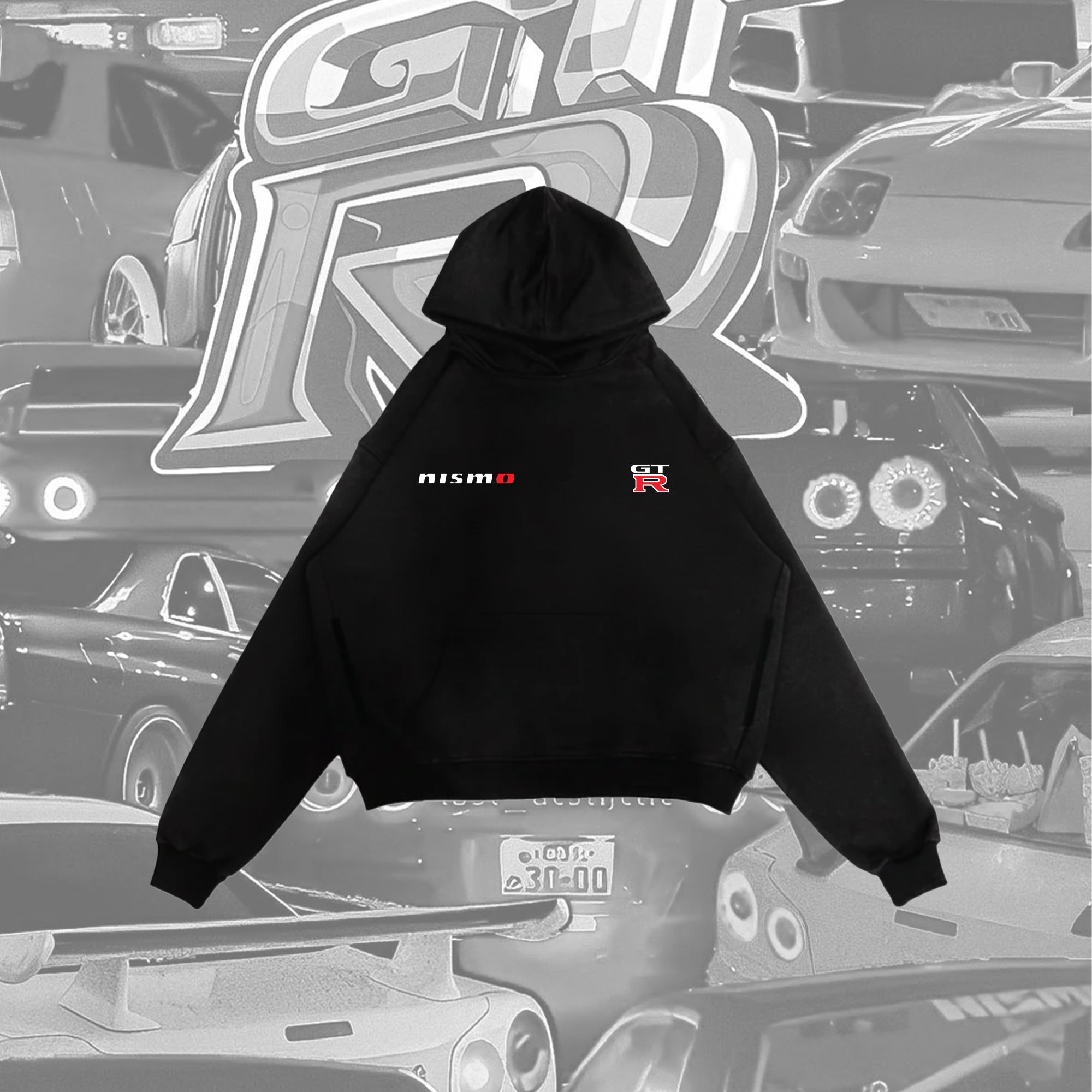 Flat lay product shot of a black hoodie's front, and small "NISMO" and "GT-R" logos on the chest.